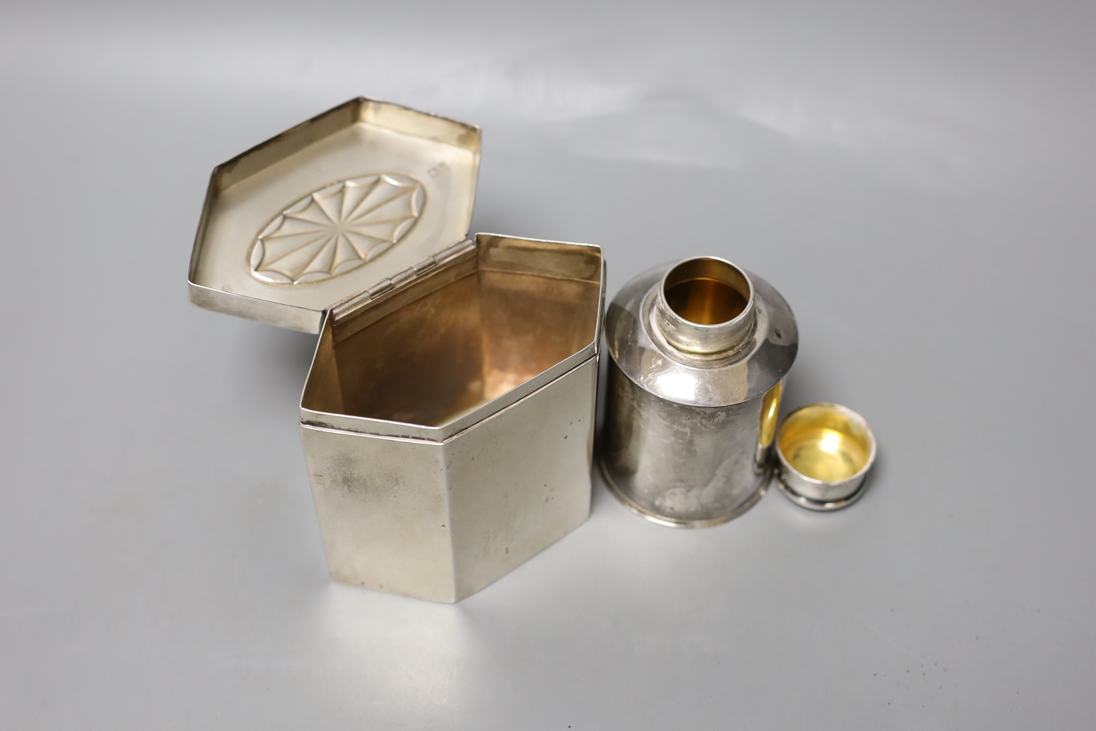 A George V silver hexagonal tea caddy, with bat's wing motif, Thomas Bradbury & Sons, London, 191, width 11.1cm and a smaller silver tea caddy